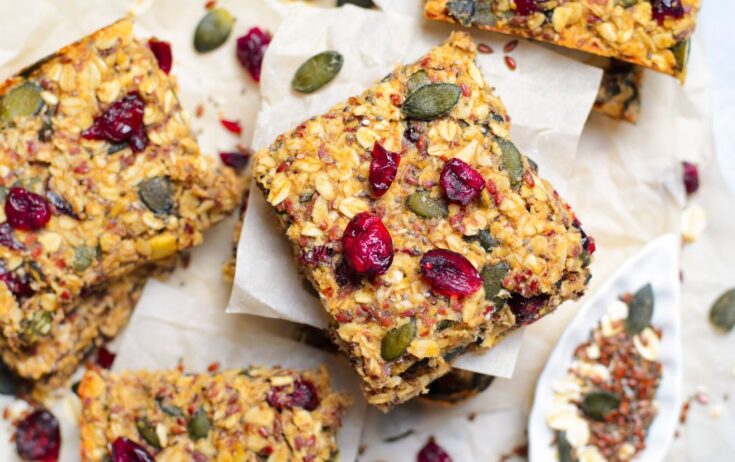 square granola bites on a white table