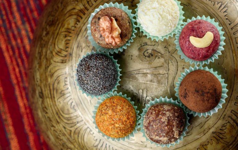 7 varieties of granola balls on a bronz plate