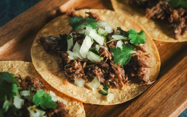 Moo shu beef served on a wooden board