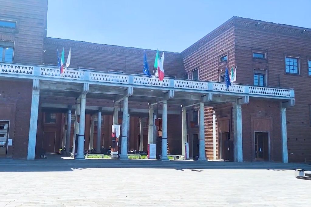 music museum in cremona with flags at the entrance