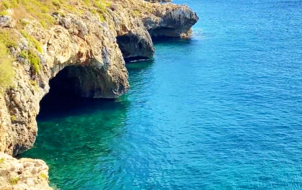 three grottoes in the clear blue water
