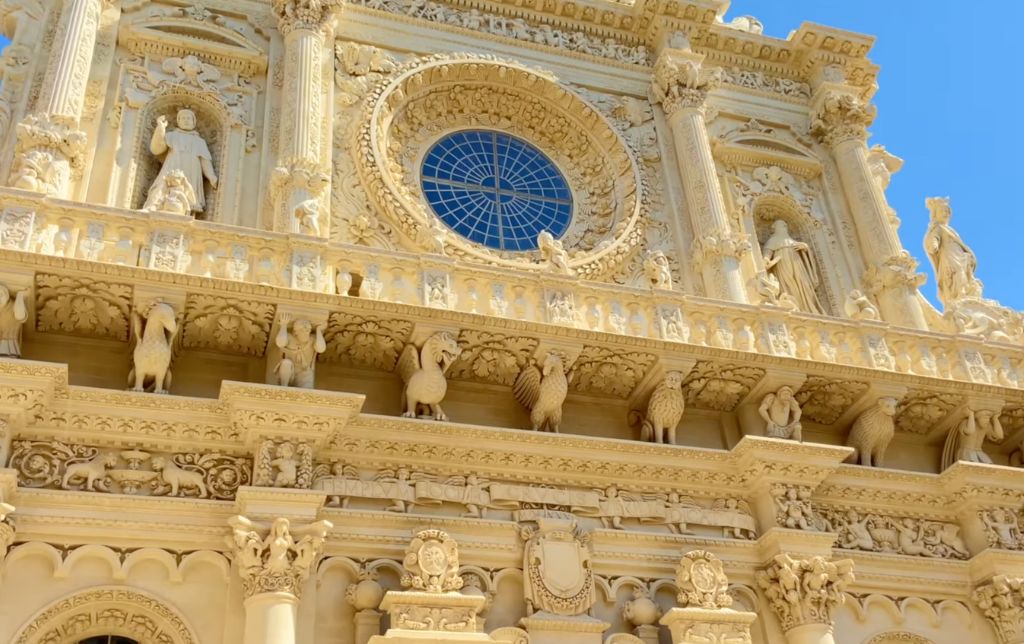 round window detail and sculptures on a church