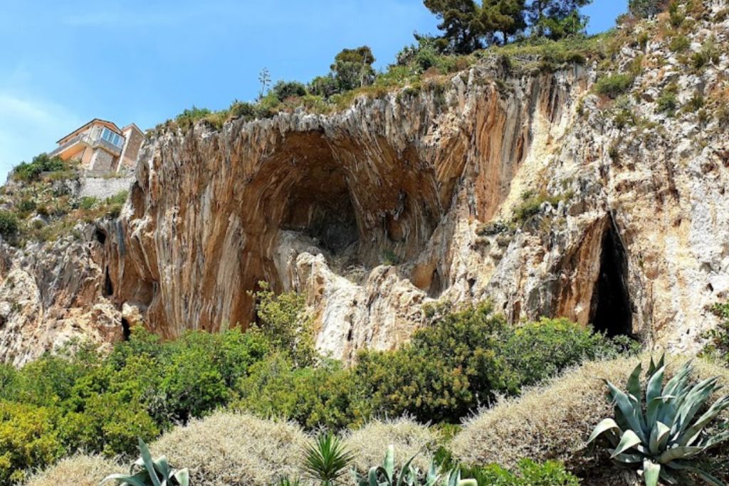 red stone cave on the shore of adriatic sea