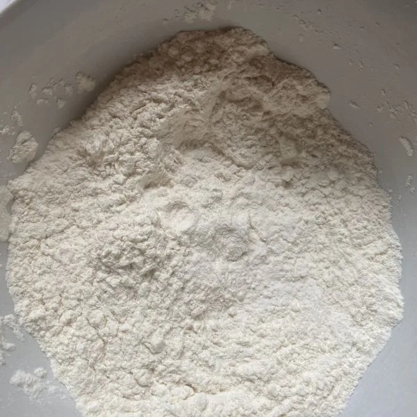 dry ingredients mixed together in a white mixer cup