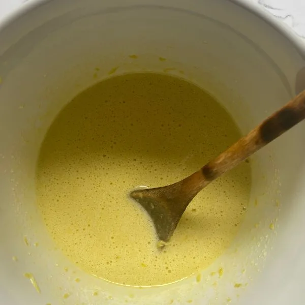 wet ingredients whipped together in a white bowl