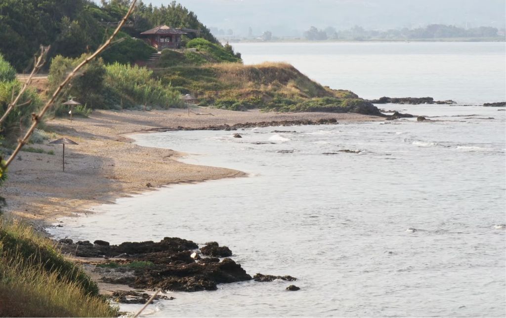 small private house and beach on a sandy shore