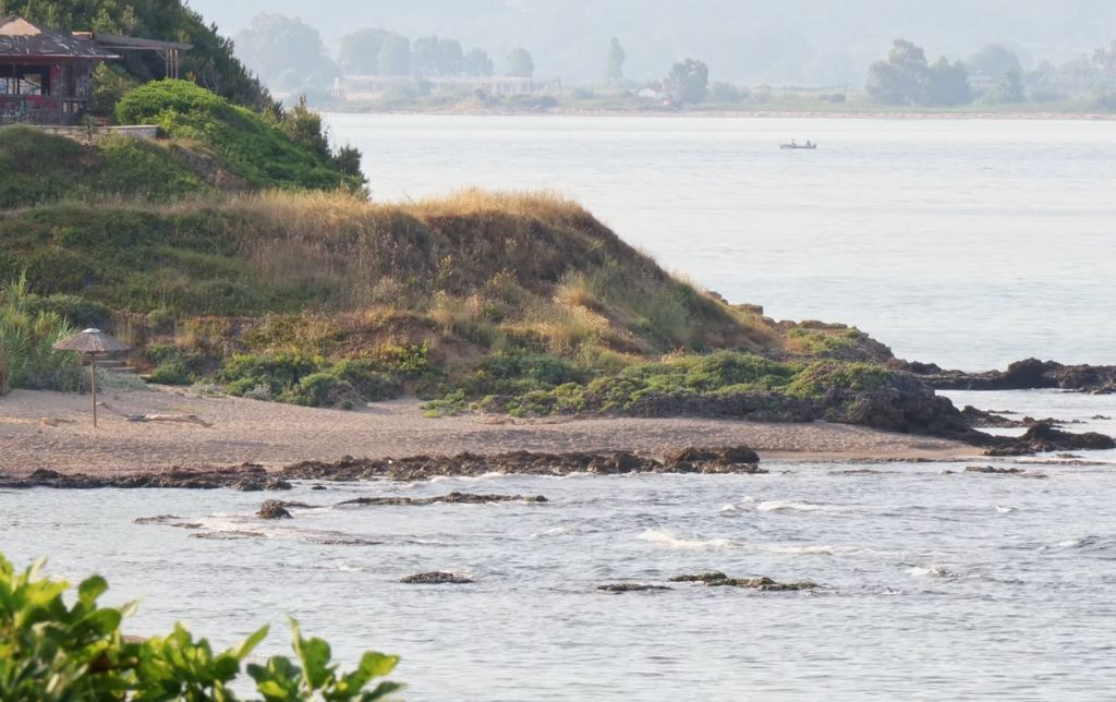 windy small golf with a house on top of it