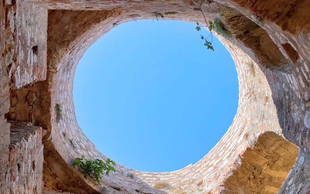 sky viewed from the bottom of a round well