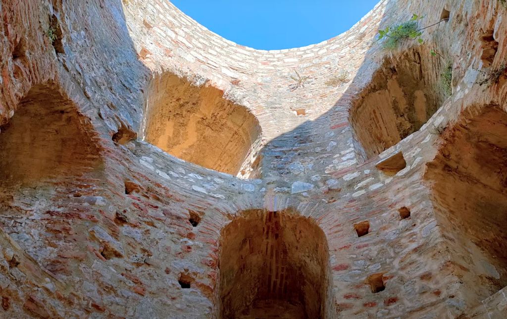 ruin of an old round tower with archways
