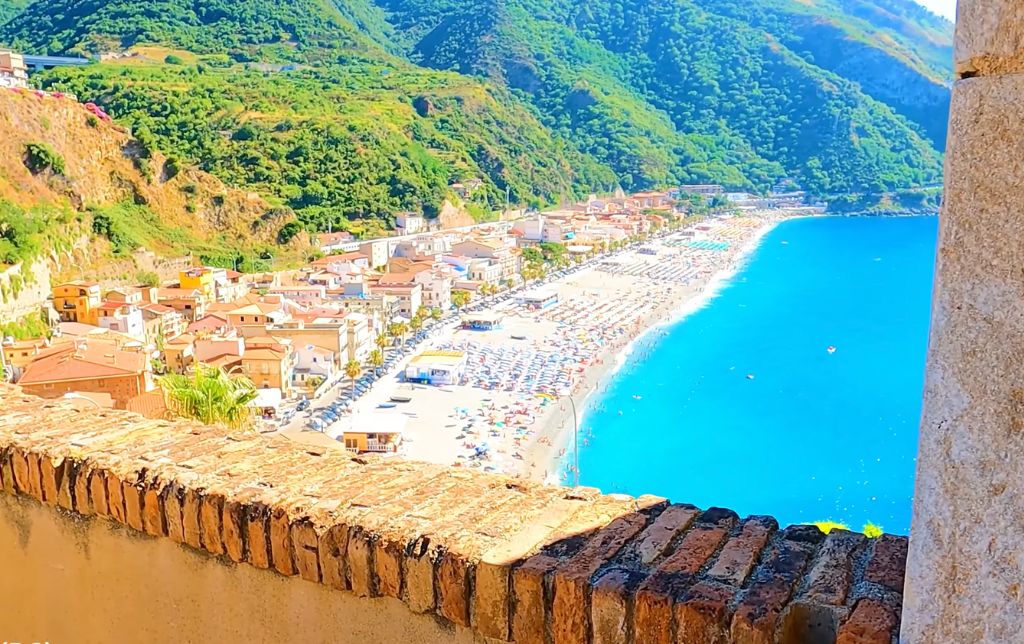 view of scilla beach and shore town from a stone balcony on the tower