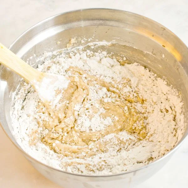 amaretti biscuits batter in an inox bowl on a white table