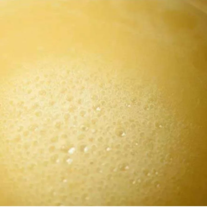 sugar and honey mix on the stive, bubbling with heat