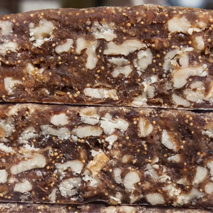 close up of two slices of panforte nero one in top of the other