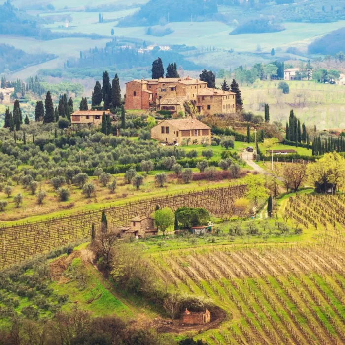 Tuscan landscape seen from the drone with an old village far away