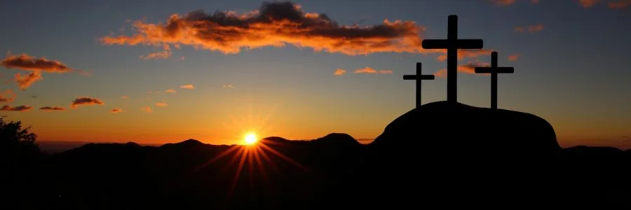 3 crosses on a hill in the dusk